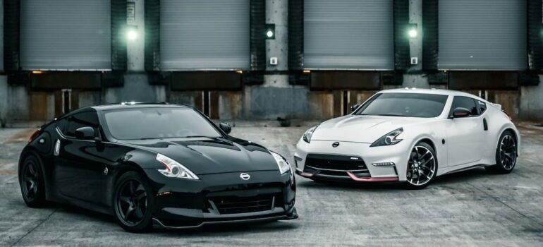 Black and white car in front of a storage