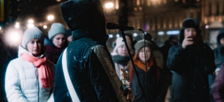 A busker playing and singing 