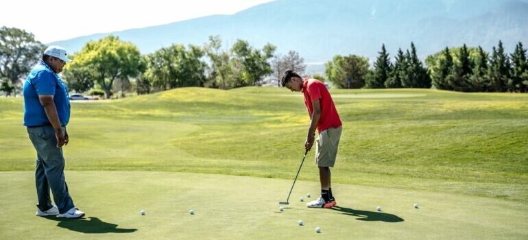 Two man playing golf 
