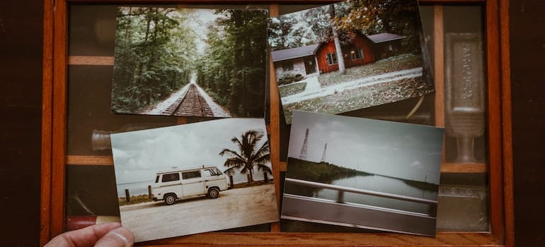 Photo of person showing old photos.