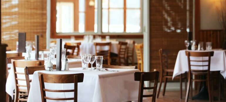 Inside of a restaurant with gasses on tables in North Austin neighborhoods