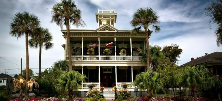Large ranch-style house with Texas flag in one of the North Austin neighborhoods