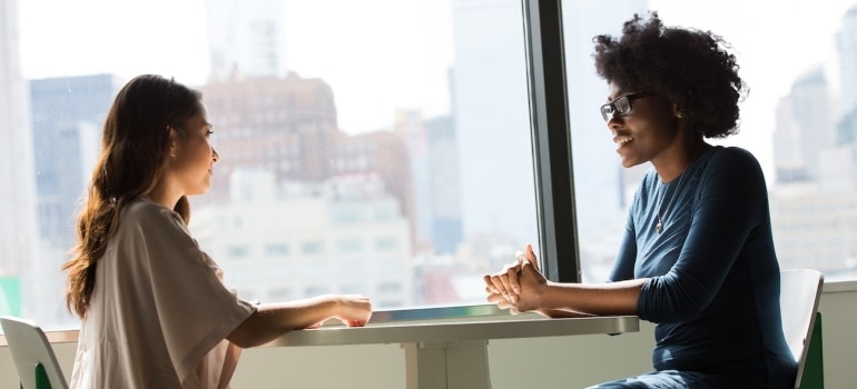 Friends talking about moving from Westlake to South Austin