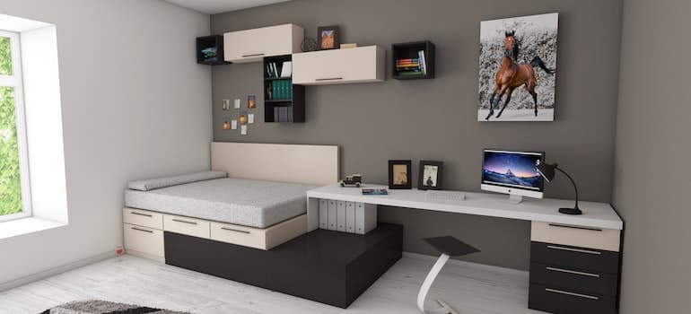 Wall with painting and pieces of furniture used to maximize space in a small Westlake apartment